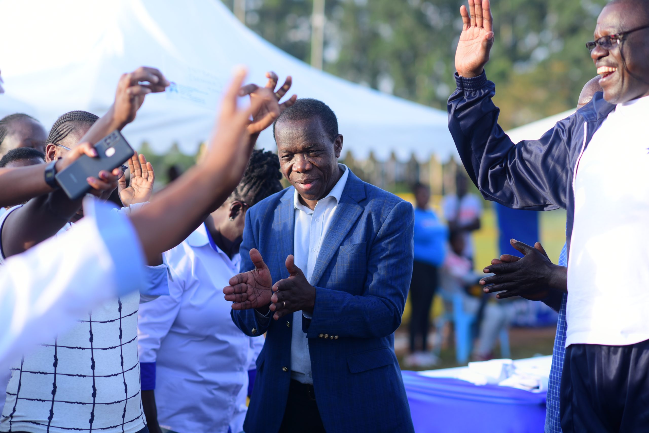 Vice Chancellor Masinde Muliro and Chairman Chris Nakitare sharing a memorable moment during a sporting event.