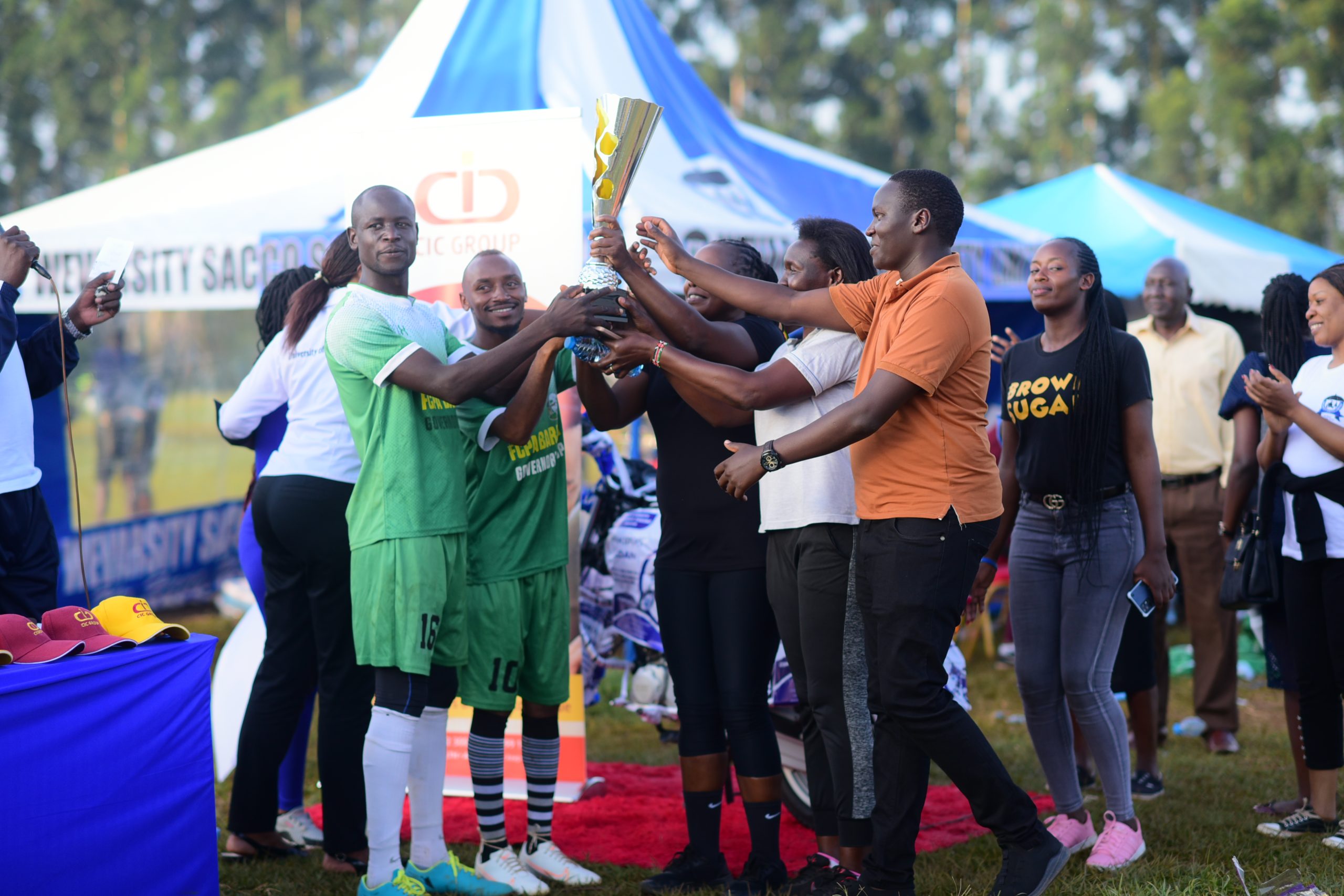 Wevarsity team lifting the trophy